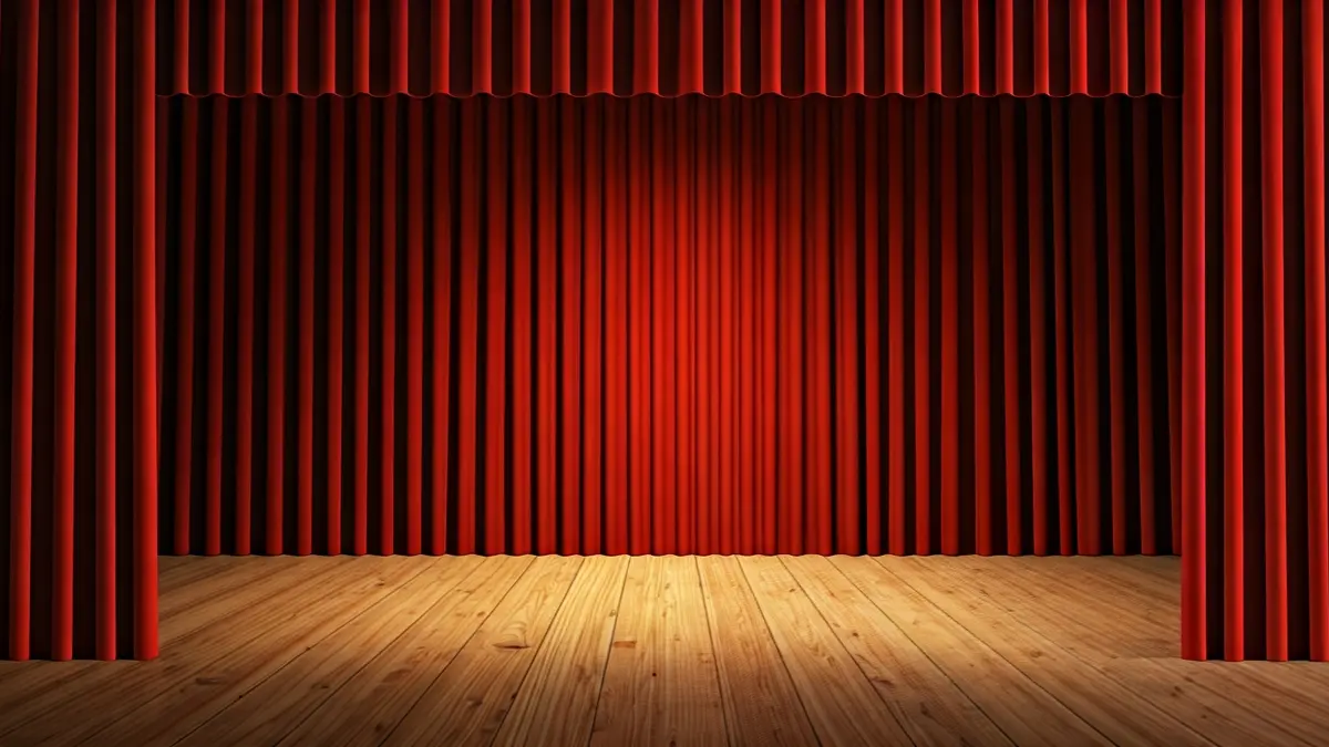 Irudi generikoa antzoki baten eszenatokiarena, oihalak irekita eta argi foku batekin.