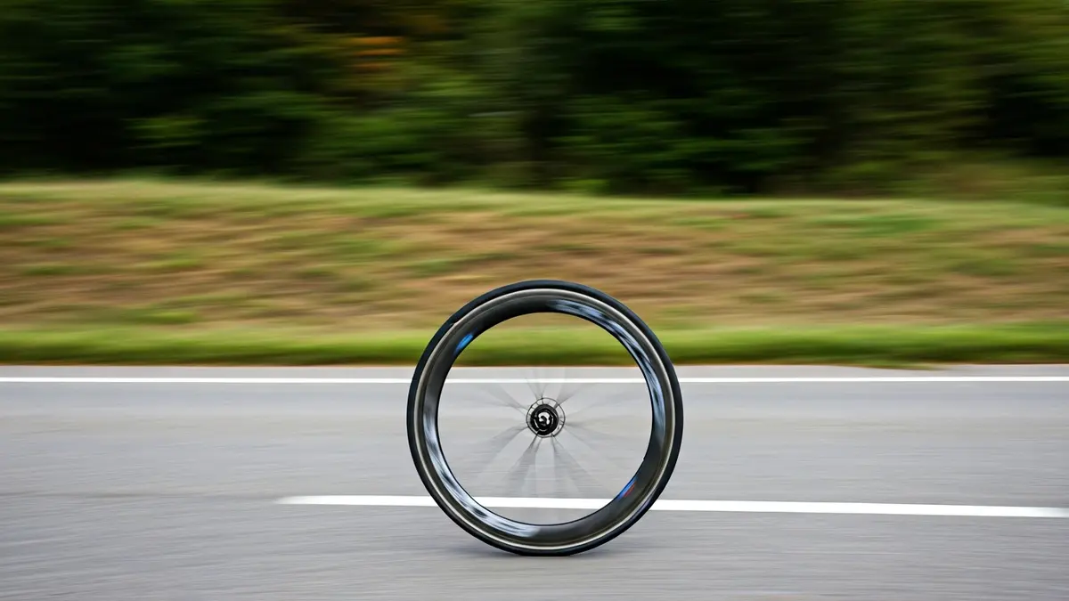 Generic image of a bicycle wheel in a race.