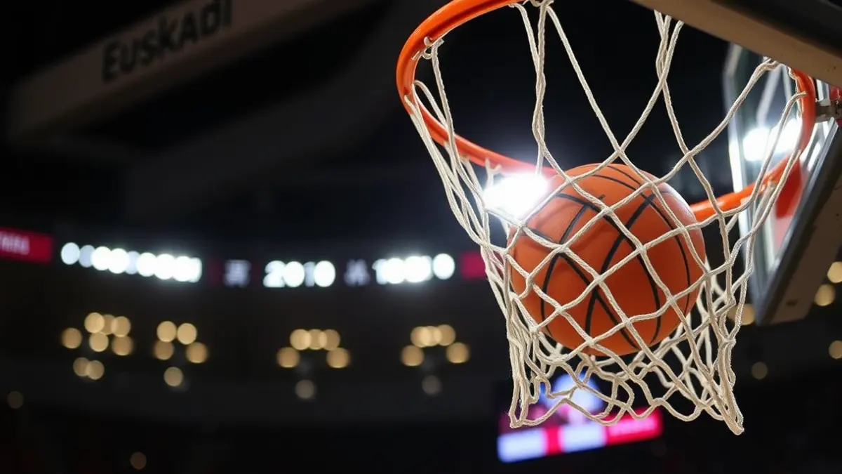Imagen genérica de una canasta de baloncesto con un balón pasando, luces de estadio difuminadas al fondo.