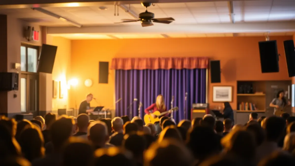Irudi generikoa gaztetxe baten barrualdeko kontzertu batena, eszenatoki eta instrumentuekin.