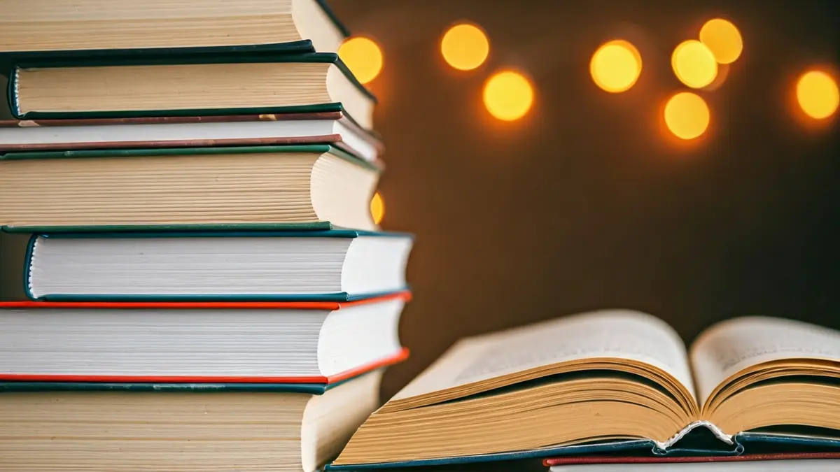 Generic image of a stack of books, suggesting creativity and learning.