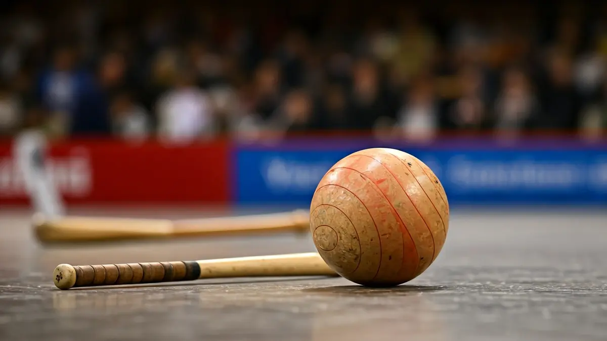 Generic image of a cesta punta ball and a cesta on a fronton court.