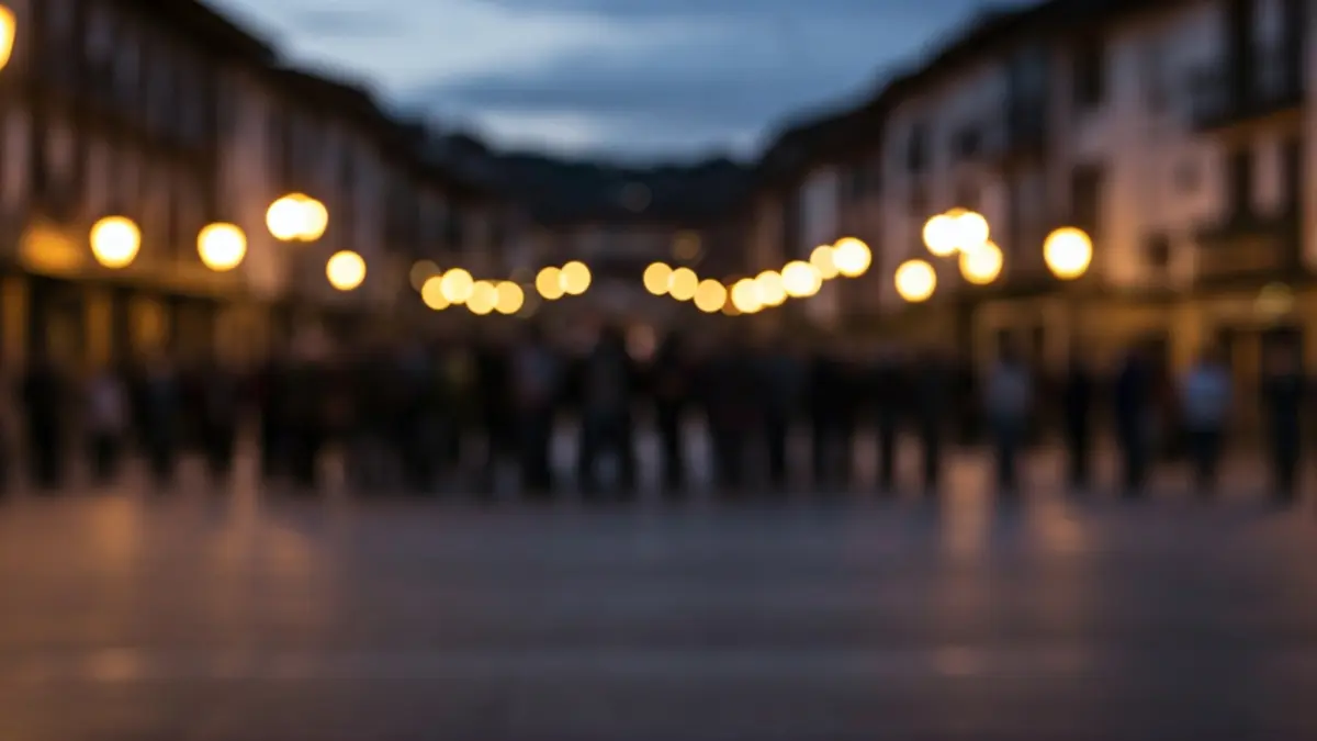 Generic image of a group of people gathered in a square at dusk, in a silent atmosphere.