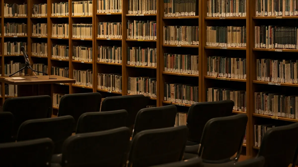 Generic image of a microphone and chairs in a library, representing a reading atmosphere.