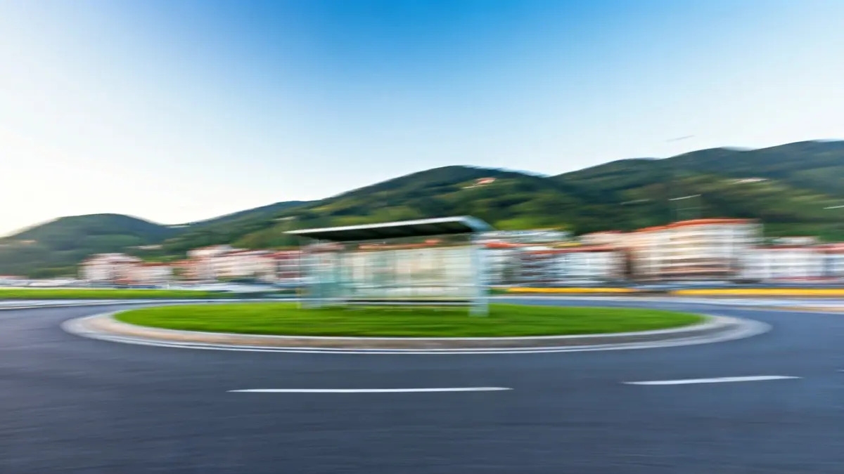 Generic image of an empty bus stop at a town roundabout.