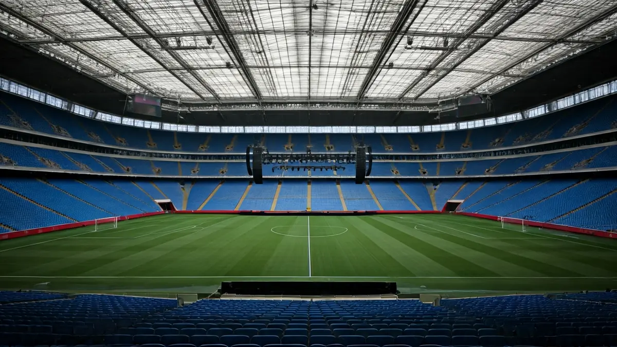 Generic image of a concert stage in a large stadium, with dramatic lighting.