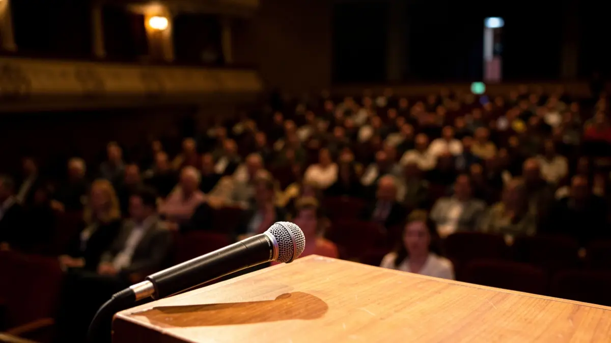 Microphone on a stage in an empty theater.