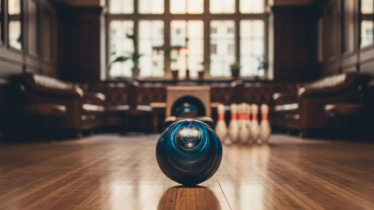 Generic image: A bowling ball rolling towards pins in a bowling alley.