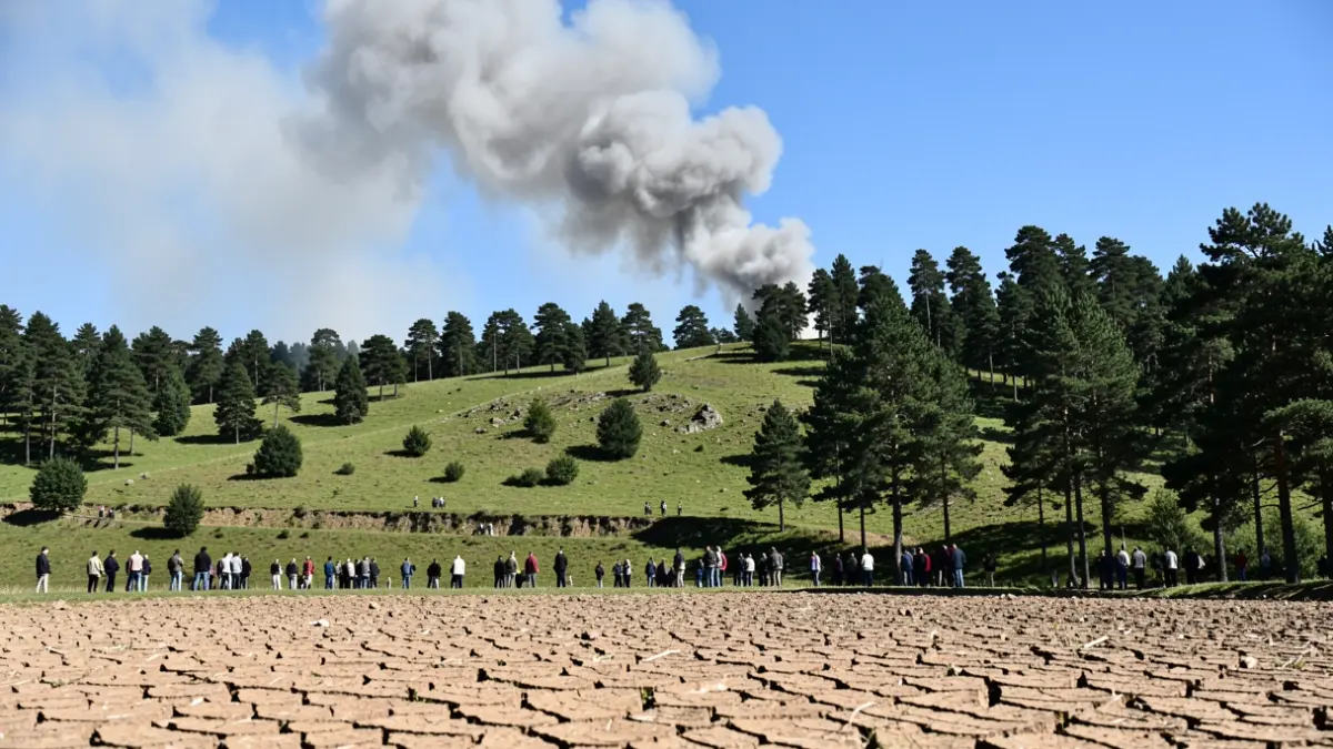 Generic image of a column of smoke on a hillside.