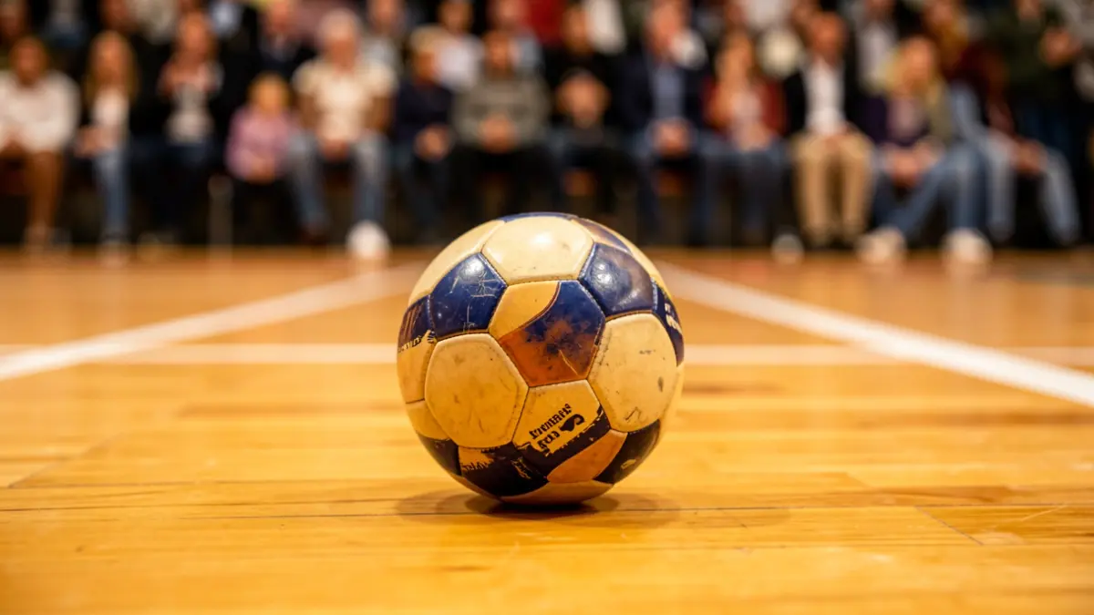 Generic image of a pelota ball on a wooden court.