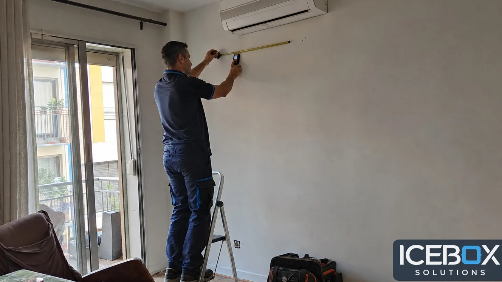 Technician preparing the installation of an air conditioning unit in a home