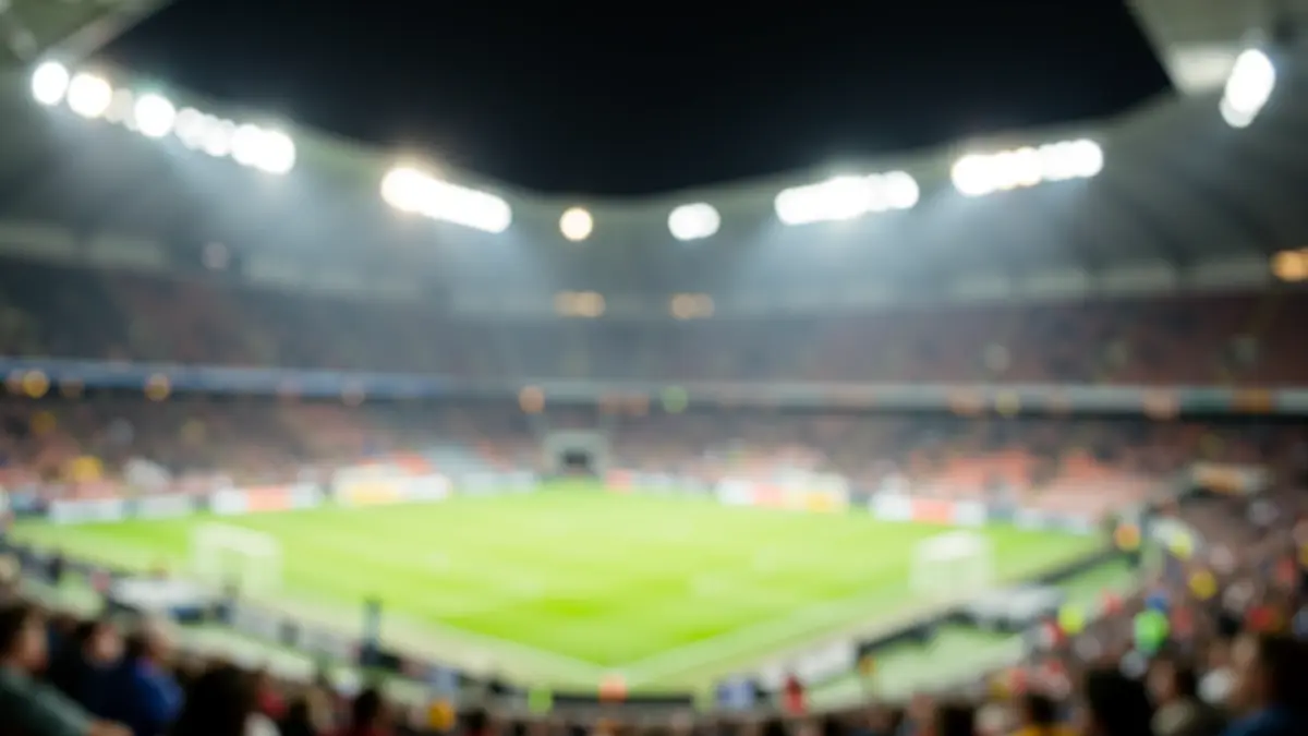 Imagen genérica de un estadio de fútbol en Anoeta, con el campo y las gradas iluminadas y desenfocadas.