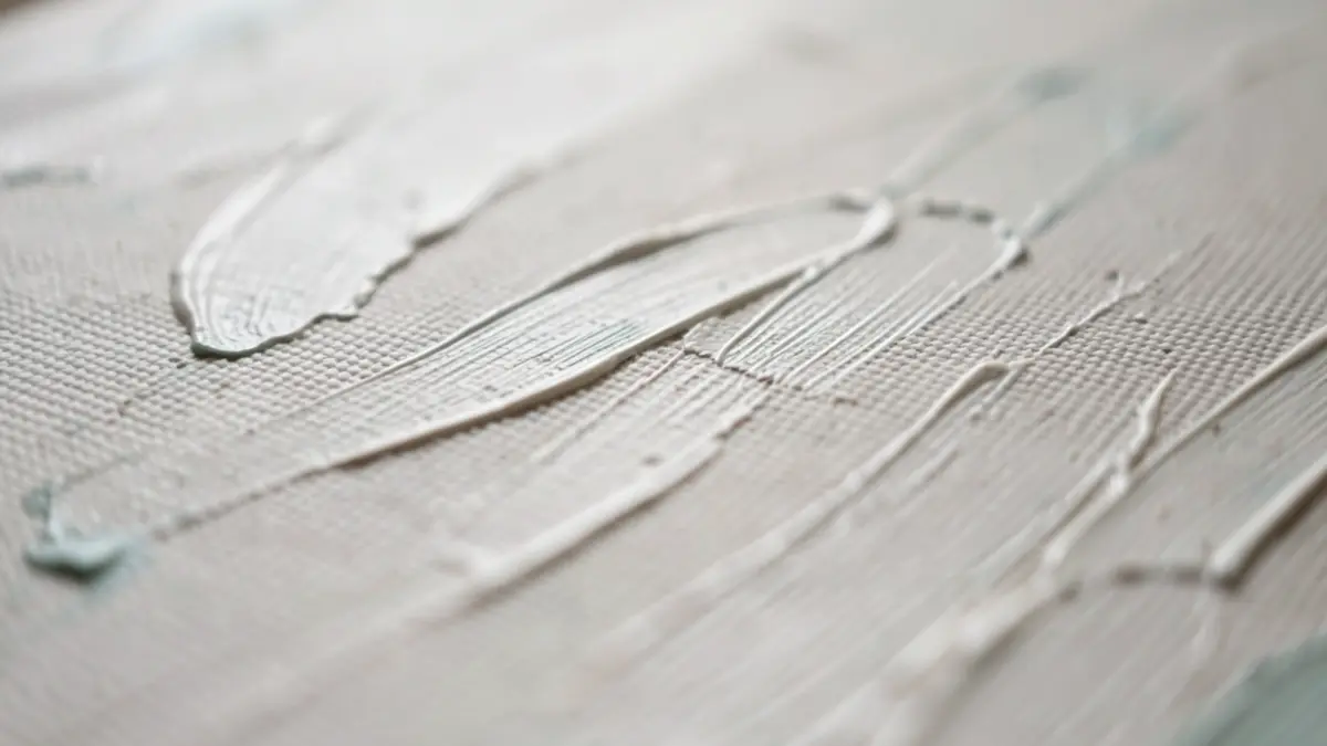 Generic image: microscopic patterns on a canvas surface, abstract representation of brushstroke analysis.