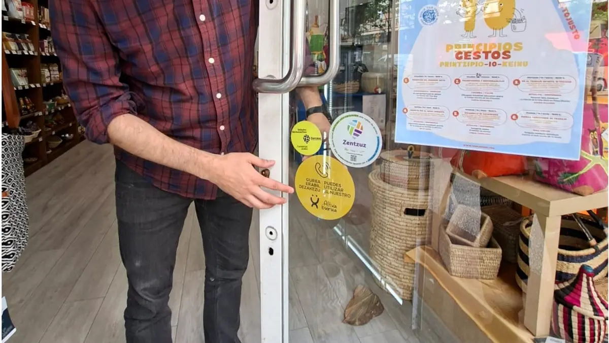 Generic image of a visible sticker on a shop window with the message 'Gurea erabil dezakezu / Puedes utilizar el nuestro'.